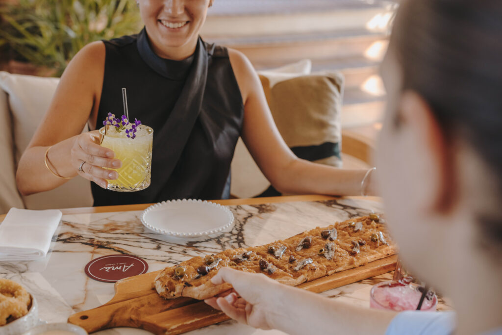 dining at a beach club in a hotel