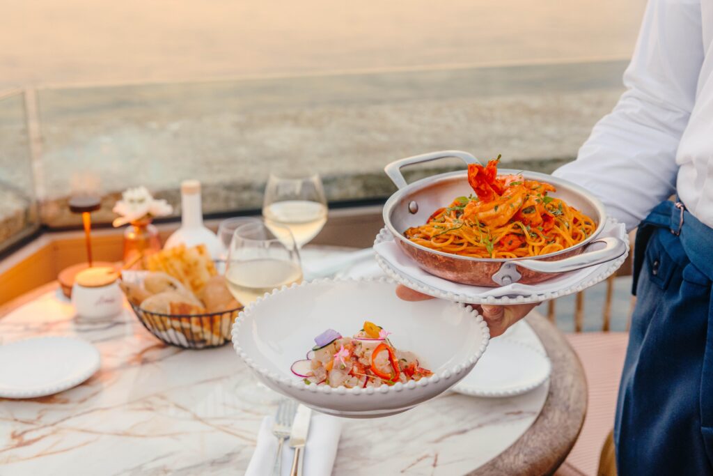 dining at a beach club in a hotel