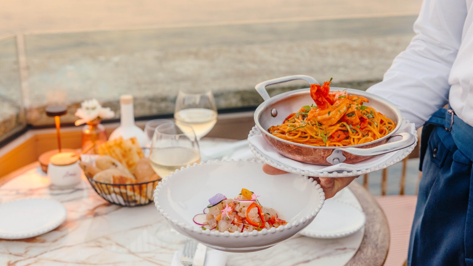 dining at a beach club in a hotel